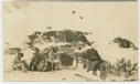 Image of Eskimos [Inughuit] in front of igloo